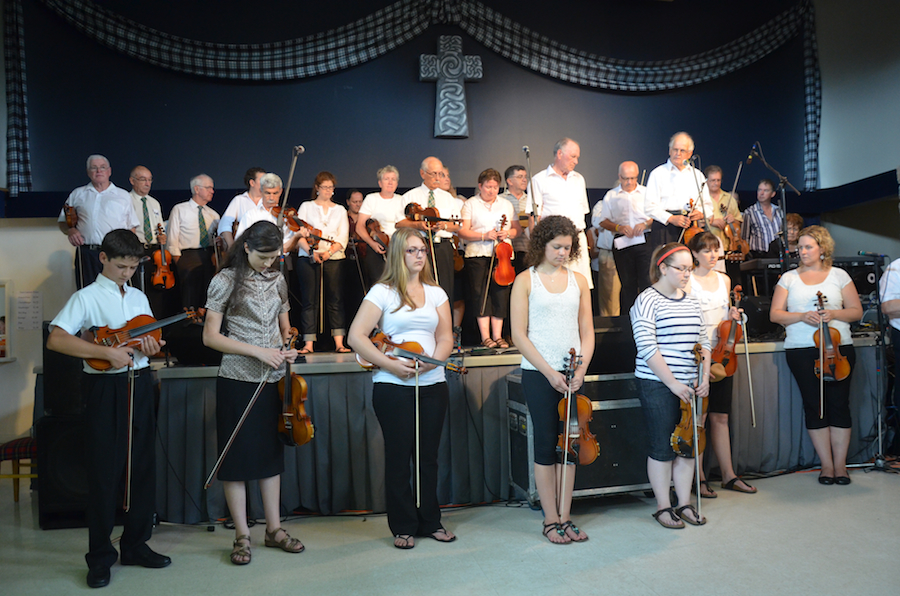 The Cape Breton Fiddlers’ Association members during the tribute prayer