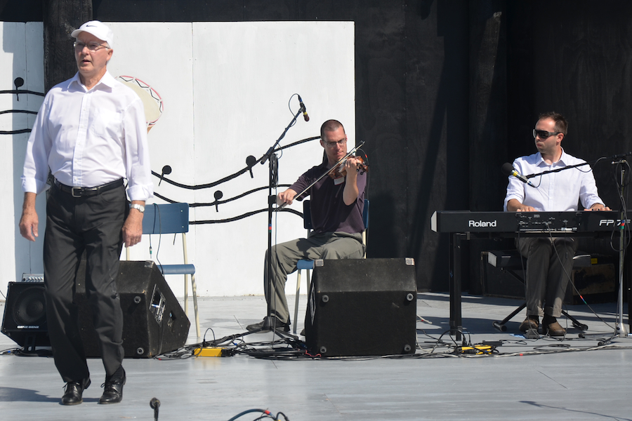 John Robert Gillis step‑dancing to the music of Mike Hall on fiddle, and Kolten Macdonell on keyboard
