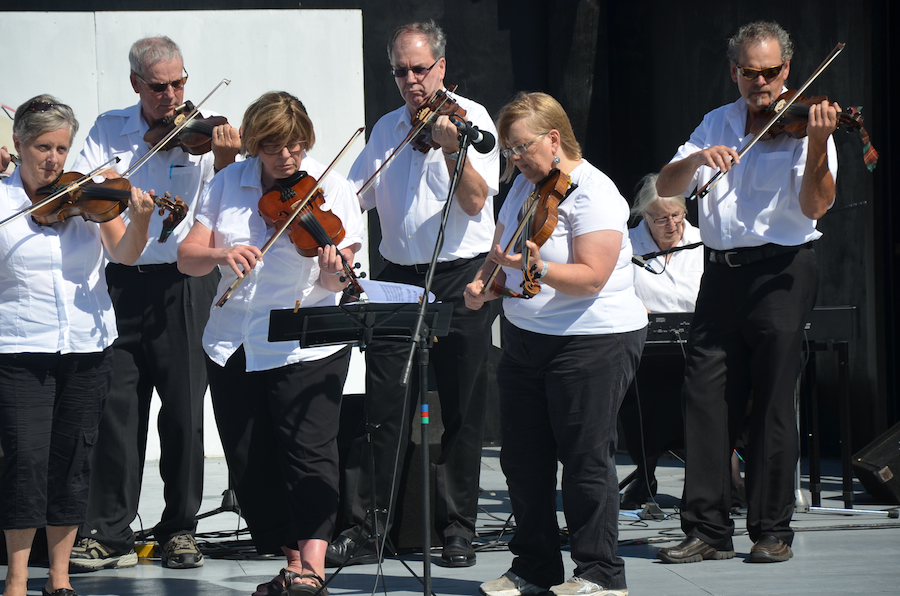 The Prince Edward Island Fiddlers directed by Kathryn Dau-Schmidt and accompanied by Marion Pirch on keyboard