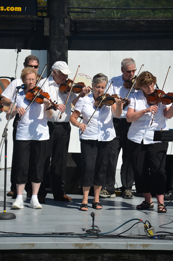 The Prince Edward Island Fiddlers directed by Kathryn Dau-Schmidt and accompanied by Marion Pirch on keyboard