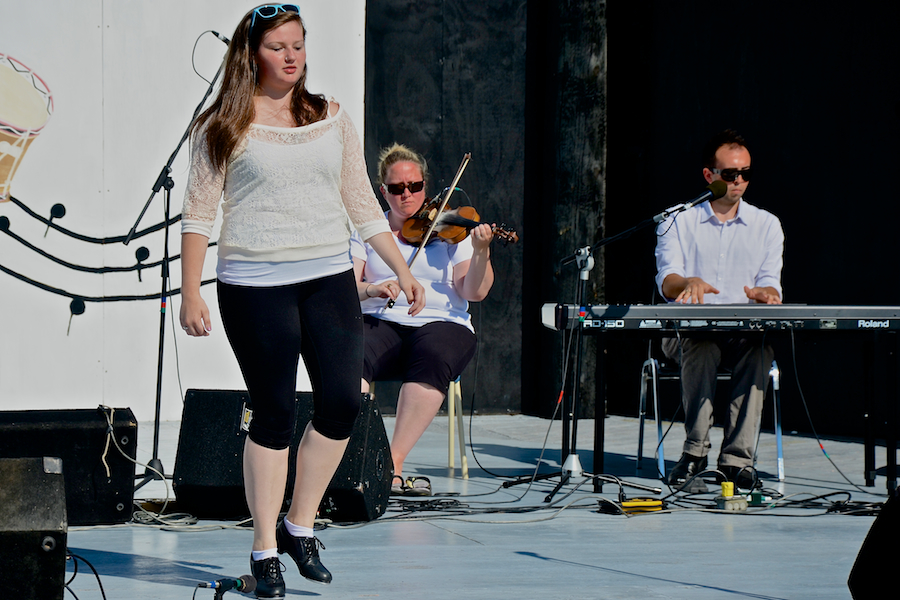 Kayla Marchand step‑dancing to the music of Dara MacDonald on fiddle and Kolten MacDonell on keyboard