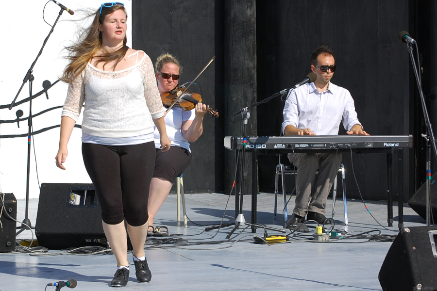 Kayla Marchand step‑dancing to the music of Dara MacDonald on fiddle and Kolten MacDonell on keyboard