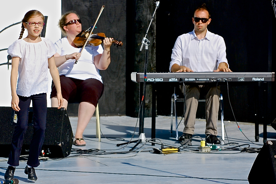 Drea Shepherd step‑dancing to the music of Dara MacDonald on fiddle and Kolten MacDonell on keyboard