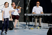 Drea Shepherd step‑dancing to the music of Dara MacDonald on fiddle and Kolten MacDonell on keyboard