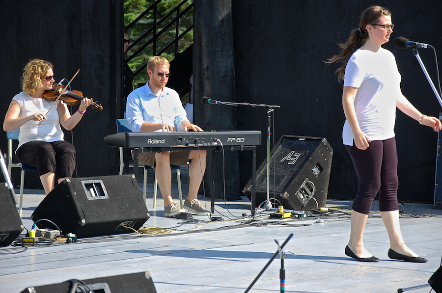 Kayla Marchand step‑dancing to the music of Leanne Aucoin on fiddle and Adam Young on keyboard