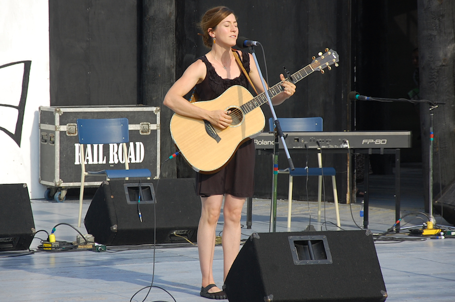 Erin Martell singing to her own guitar accompaniment