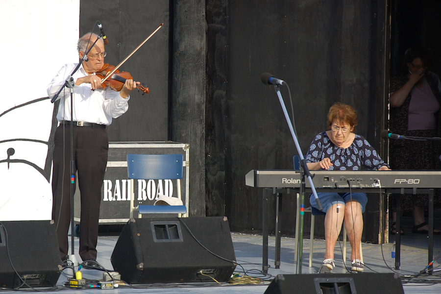 Father Francis Cameron on fiddle accompanied by Janet Cameron on keyboard