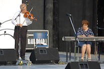 Father Francis Cameron on fiddle accompanied by Janet Cameron on keyboard