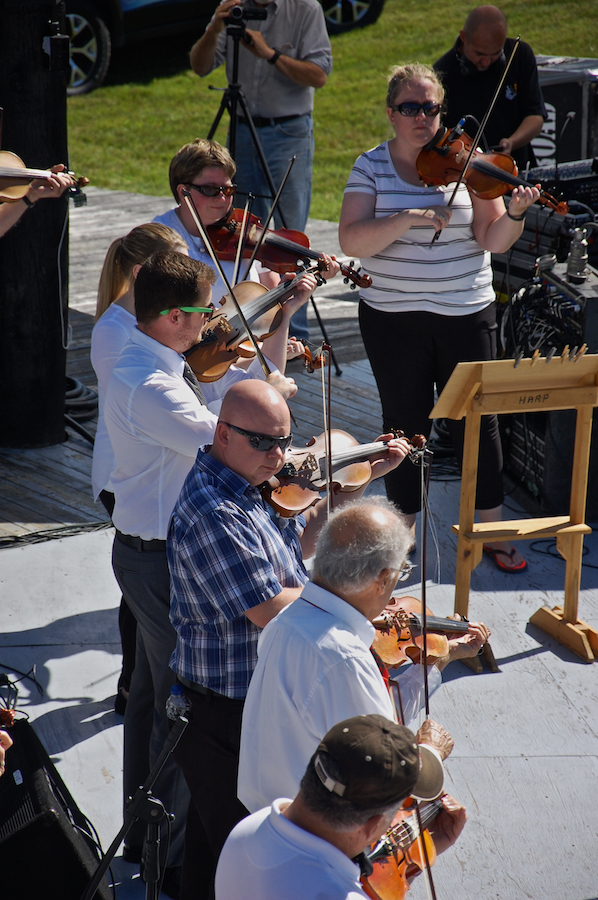 The Cape Breton Fiddlers’ Association plays its second group number in tribute
