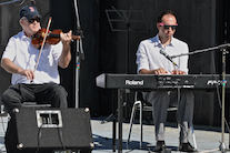 Bernard MacDonnell on fiddle accompanied by Kolten MacDonell on keyboard
