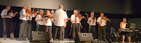 The Feisty Fiddlers directed by Eddie Rogers and accompanied by Carol Ann MacDougall on keyboard