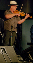 Kyle MacNeil on fiddle playing a lament