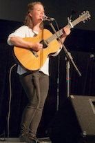 Mary Beth Carty singing and accompanying herself on guitar