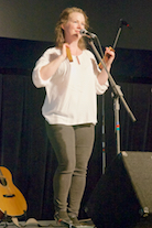 Mary Beth Carty singing and accompanying herself on “bones”