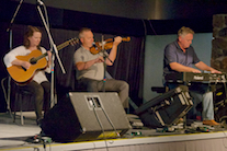 Rodney MacDonald on fiddle, Howie MacDonald on keyboard, and Mary Beth Carty on guitar