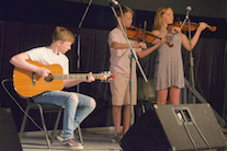 John Angus and Mary Anna MacNeil on dual fiddles, accompanied by Malcolm MacNeil on guitar