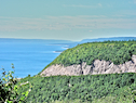 Cabot Trail climbing Smokey Mountain seen from the Cape Smokey Provincial Park