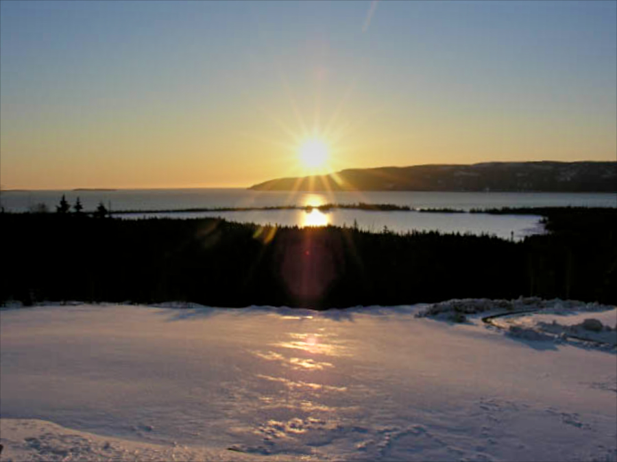 Sunrise over Cape Dauphin from above Red Island