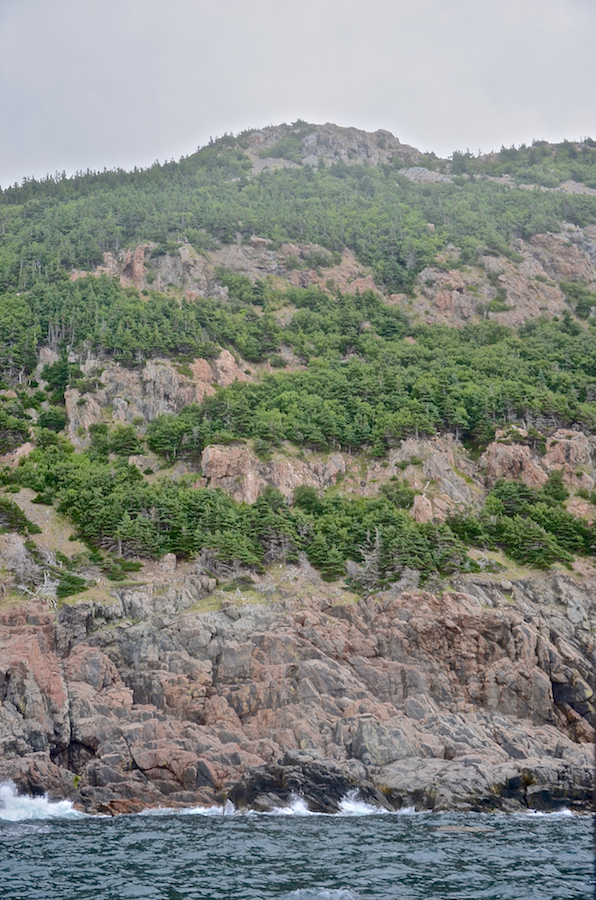 The peak and the cliffs below