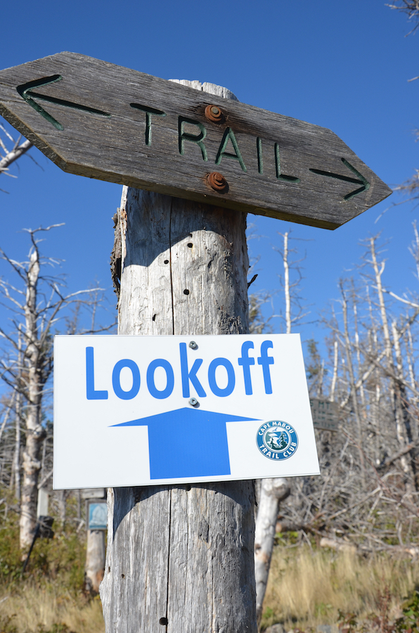 New and old trail signage at the junction with the side trail to the look-off