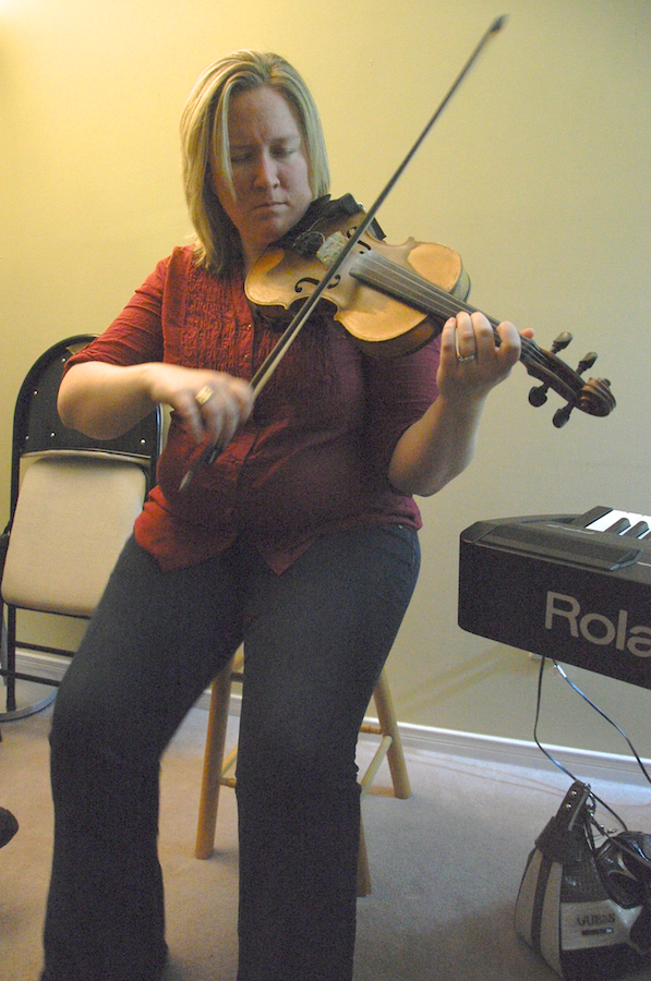 Photo of Dara Smith-MacDonald on fiddle