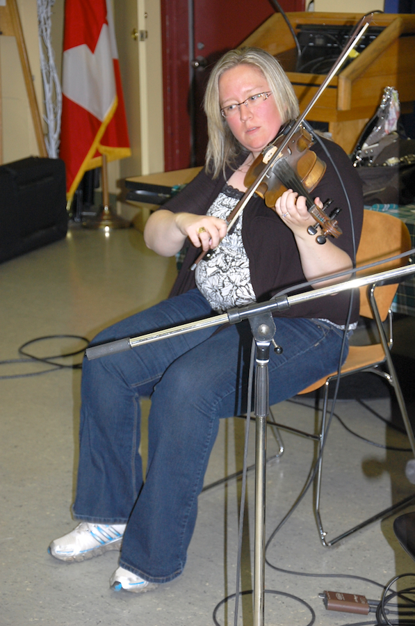 Photo of Dara Smith-MacDonald on fiddle