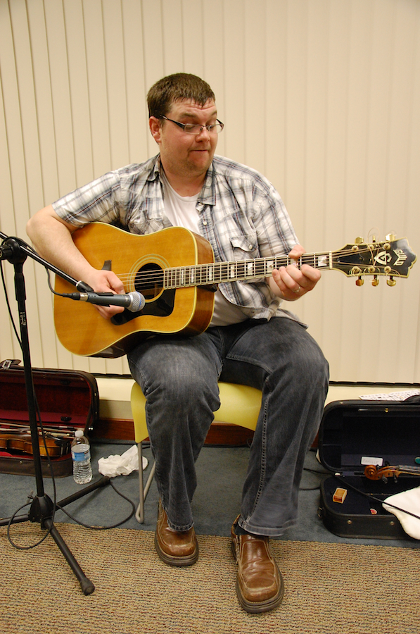 Photo of J. J. Chaisson on guitar