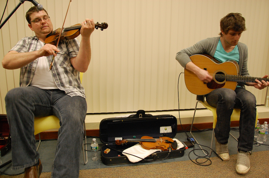 Photo of J. J. Chaisson on fiddle accompanied by Koady Chaisson on guitar