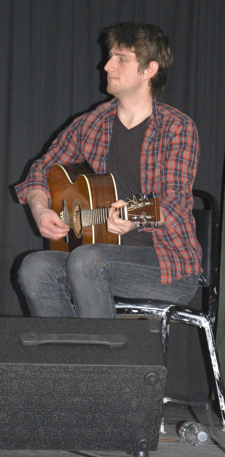 Photo of Koady Chaisson on guitar