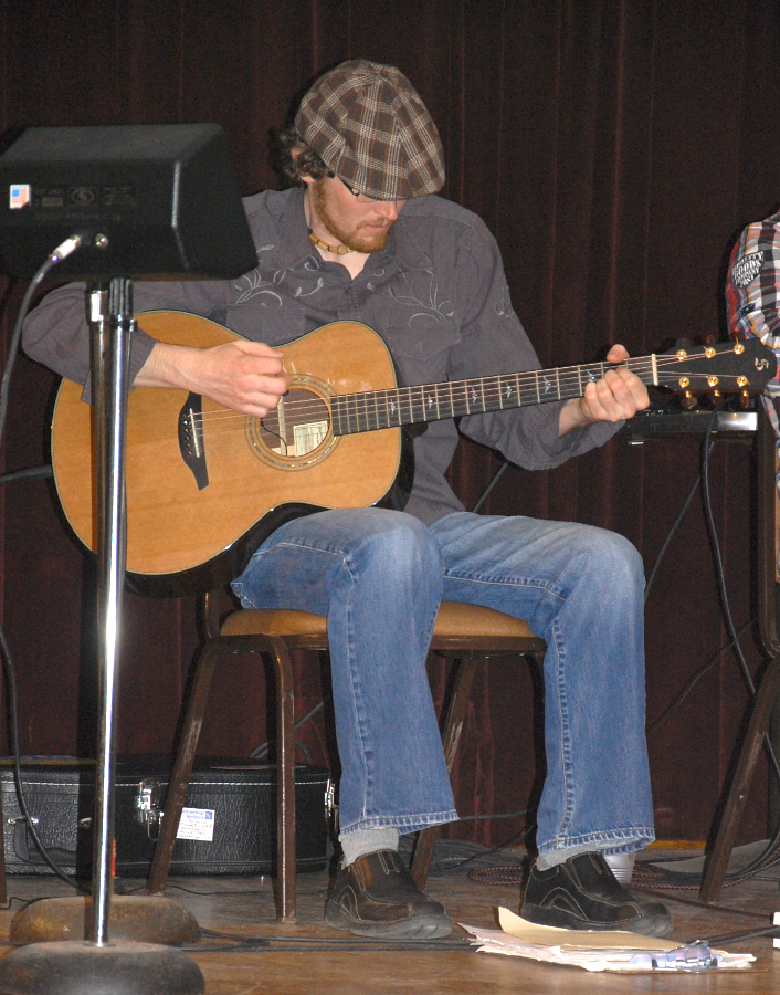 Photo of Jason MacDonald on guitar
