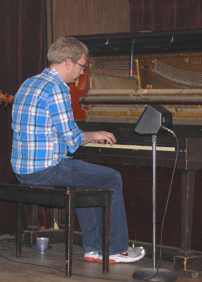 Photo of Adam Young on piano