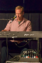 Adam Young playing a solo on keyboard