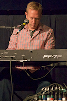 Adam Young playing a solo on keyboard