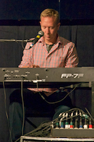 Adam Young playing a solo on keyboard