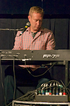 Adam Young playing a solo on keyboard