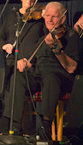 Fr Charlie Cheverie on fiddle