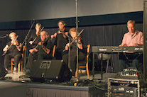 A contingent of the PEI Fiddlers accompanied by Adam Young on keyboard