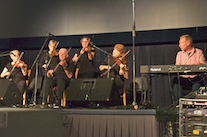 A contingent of the PEI Fiddlers accompanied by Adam Young on keyboard