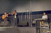 Ashley MacIsaac on fiddle accompanied by Mary Beth Carty on guitar and by Kolten Macdonell on keyboard