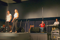 Janelle and Lauren Boudreau step dancing to the music of Mike Barron on fiddle and Kolten Macdonell on keyboard