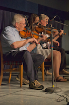 Donald MacPhee, Koryne Fraser, and Bernard McDonell on triple fiddles