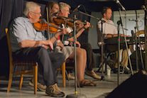 Donald MacPhee, Koryne Fraser, and Bernard McDonell on triple fiddles accompanied by Kolten Macdonell on keyboard