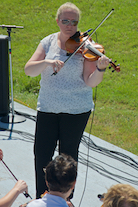 Dara Smith-MacDonald directing and on fiddle