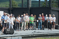 Bob MacEachern, speaking for the Cape Breton Fiddlers’ Association in the company of three living founders of the Association and many members of its current Board of Directors, welcomes those present