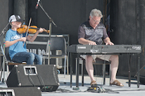 Iain MacQuarrie on fiddle accompanied by Howie MacDonald on keyboard