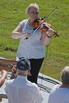 Dara Smith-MacDonald directing on fiddle