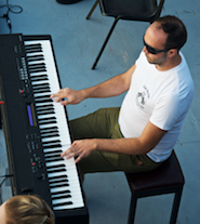 Kolten Macdonell accompanying on keyboard