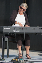 Carol Ann MacDougall playing a solo on keyboard