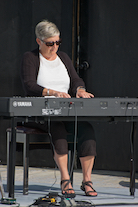 Carol Ann MacDougall playing a solo on keyboard