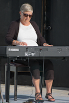 Carol Ann MacDougall playing a solo on keyboard